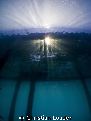 sunburst under the jetty in the morning. Olympus SP-350, ... by Christian Loader 